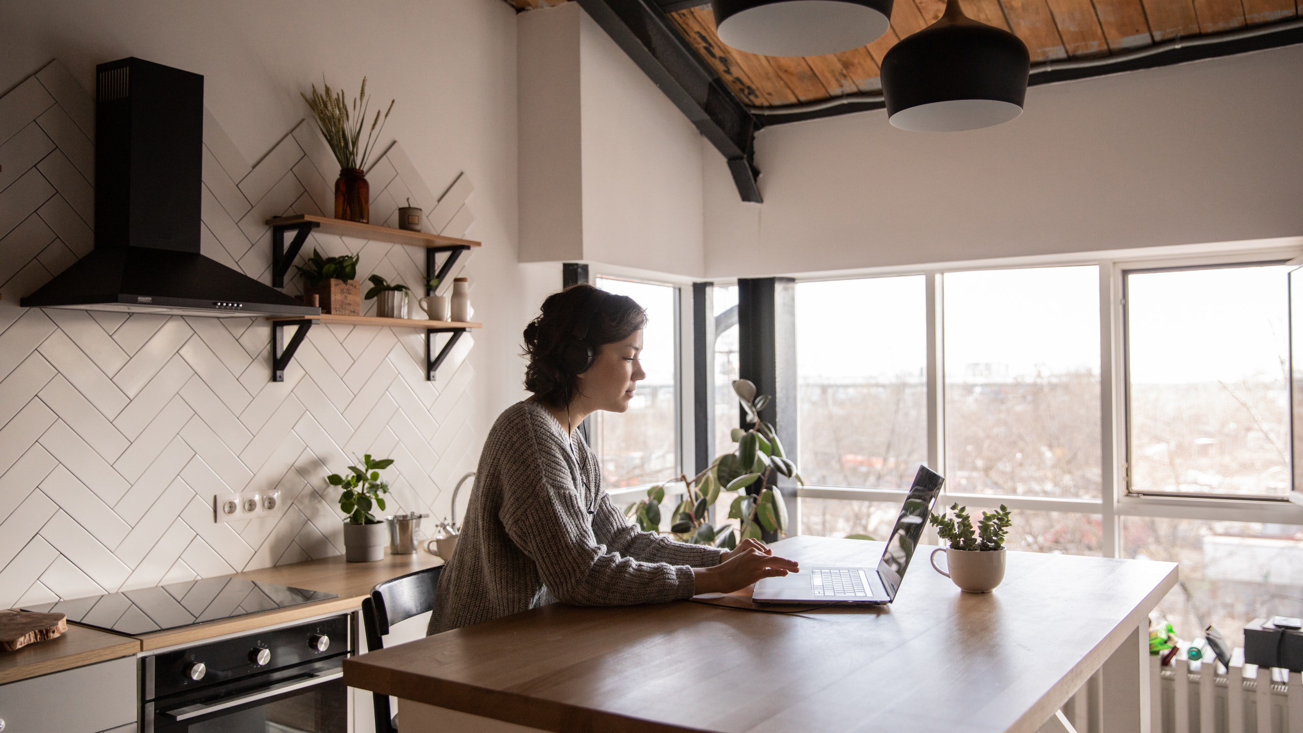 A woman is working remotely