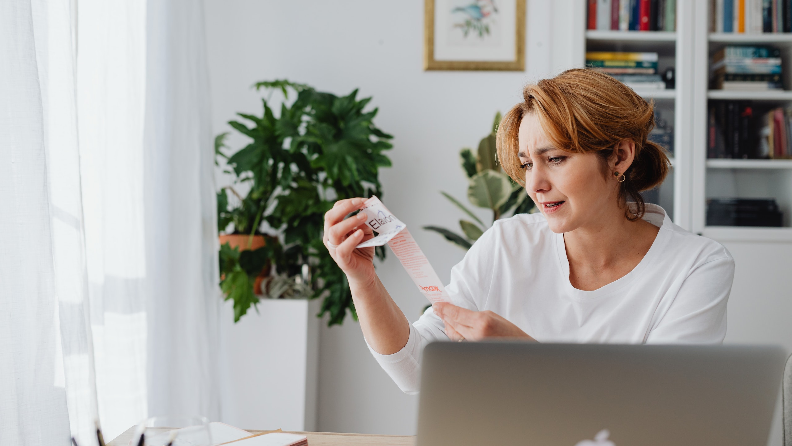 A woman is tracking her expenses