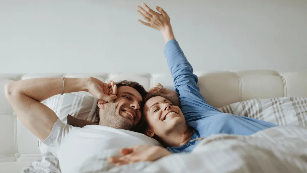A couple waking up refreshed.
